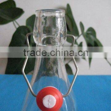 glass bottle with metal clip and plastic lid