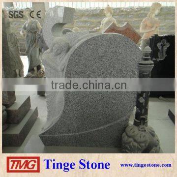 Standing angel statue monument light grey granite tomb