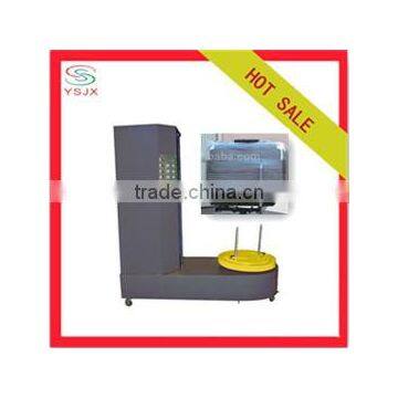 Semi automatic film wrapping luggage packing machine