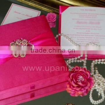 Designer wedding Invitation card with a brooch and ribbon