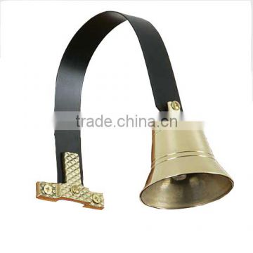 small brass bells with accessory as door decoration