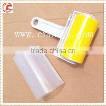 Lint roller with adhesive sticker