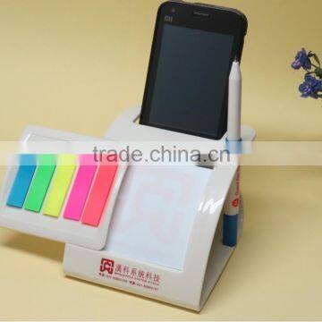 Multifunctional sticker with pen/mobile phone holder