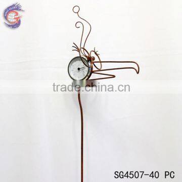 rusty metal bird stakes with thermometer for garden decor