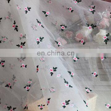 Green pink embroidered fabric