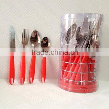 Red handle cutlery set in stand spoon and fork