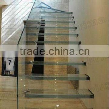 Laminated glass tread stair with glass handrail