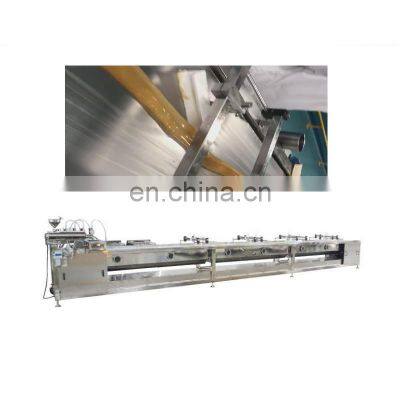 Hot sugar syrup candy cooling machine