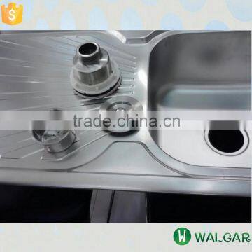 Stainless steel kitchen sink with tray and strainer