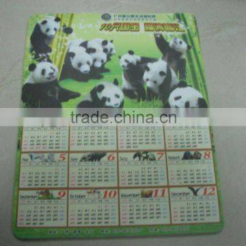 mouse pad with calendar and panada picture inside