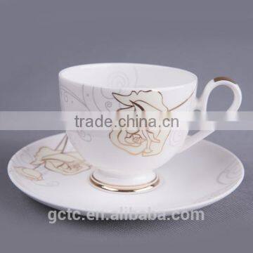 Bone china cup and saucer with gold rose