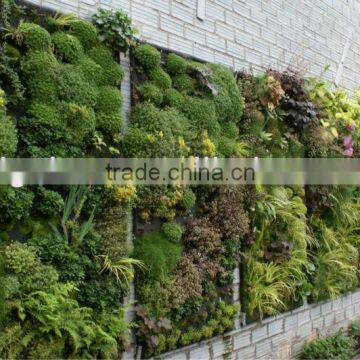 artificial plant wall with leaves/flowers/grass