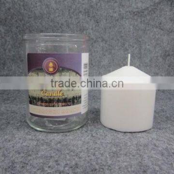 Religious candles in different glass size pillar shape