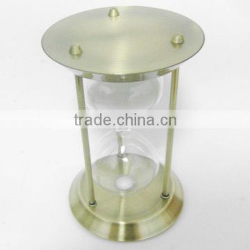 glass sand timer with metal frame; metal hourglass