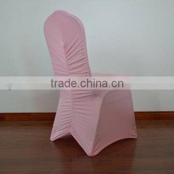 Peach rouched/shirred spandex chair cover for wedding