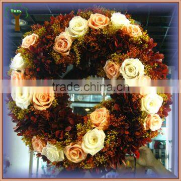 Preserved red boxwood wreath mixed with rose flowers for indoor decoration