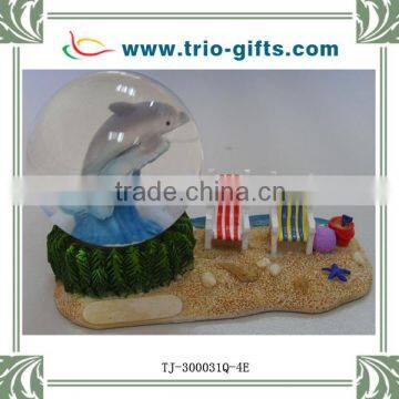 Resin dolphin and beach chair water ball