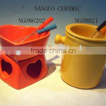 ceramic fondue pot at heart shape with fork