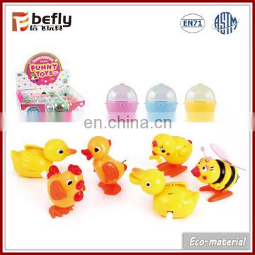 Novelty toy plastic wind-up chick in capsule