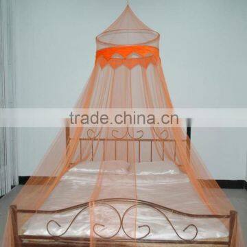 Circular bed canopy with decorative fabric and beads