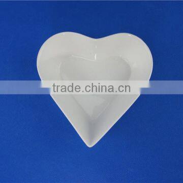 white ceramic heart shaped bowl