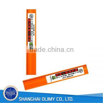 Olimy orange fiberglass marker post used for damage prevention