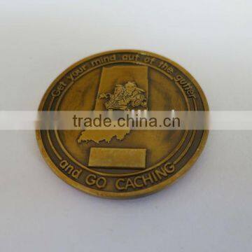 Fancy bronze metal coin with raised logo