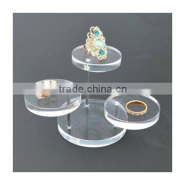 Round acrylic jewelry display stand with tiers