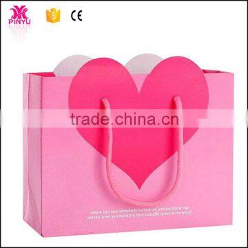 White kraft paper with pink printing square bottom shopping paper bag with plastic handle