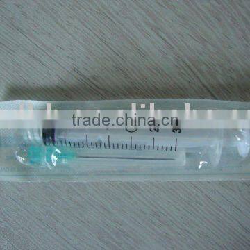 disposable syringe in blister package with aside needle