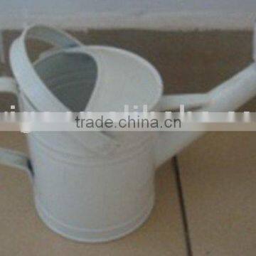 garden white metal watering can