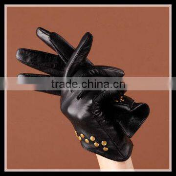 fashion designed women wearing gloves with nails leather