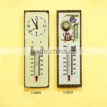 metal outdoor clock and thermometer