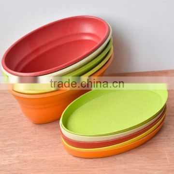 Small colored plant fiber ship shape plastic planter with saucer