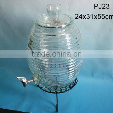 large clear drum shaped glass jar with glass lid and tap